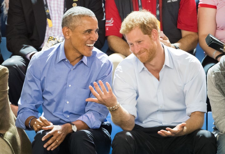 Former President Barack Obama and Prince Harry watch wheelchair basketball at the Invictus Games in Toronto on Sept. 29, 2017.