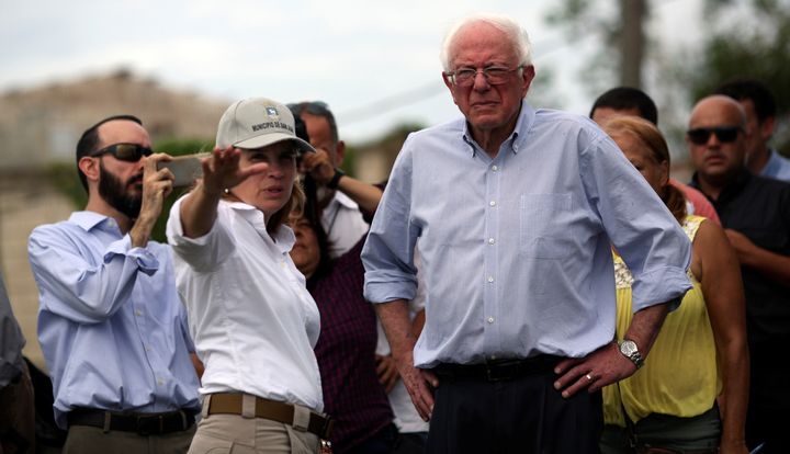 San Juan Mayor Carmen Yulín Cruz shows Sen. Bernie Sanders (I-Vt.) the damage from Hurricane Maria during Sanders' visit to the island on Oct. 27.