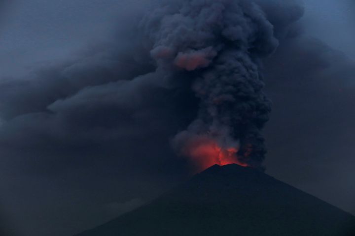 Bali's Mount Agung volcano, pictured above on Monday, has led to the closure of the holiday destination's airport being extended