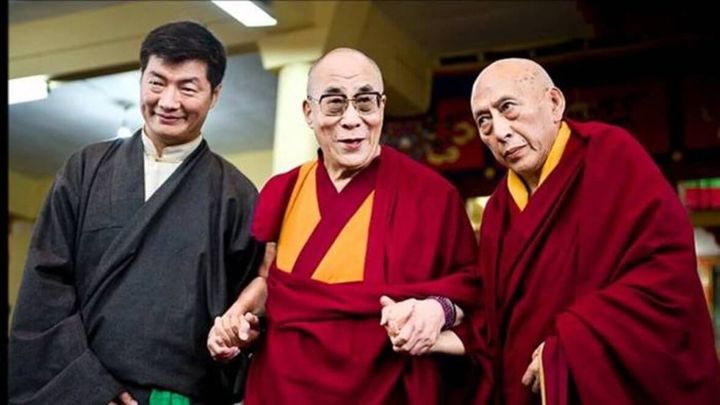 H.H. the 14th Dalai Lama holds hands with Lobsang Sangay (L) the present Prime Minister of the CTA, and ex-Prime Minister Samdhong Rinpoche.