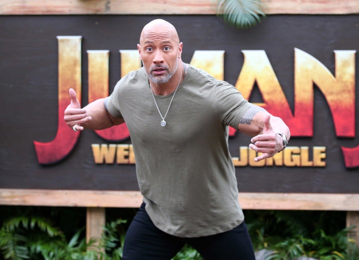 Dwayne "The Rock" Johnson, pictured Nov. 27, now has a bodacious bull skull tattoo on his upper arm.