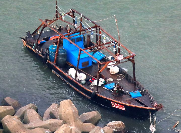 Eight men who said they are fishermen from North Korea were found with this boat on Friday along northern Japan's coast.