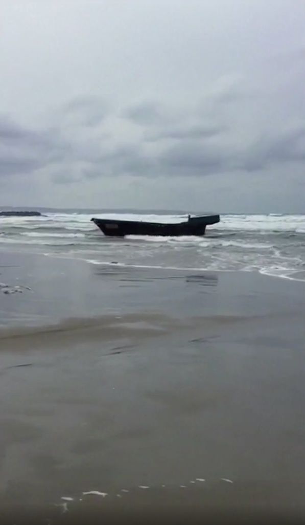 This ghost ship that washed ashore in Japan was found carrying eight bodies, authorities said.