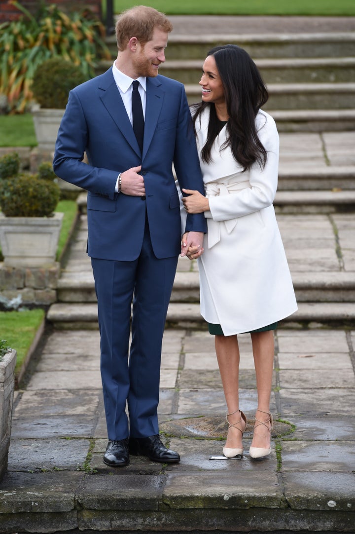 Britain's Prince Harry poses with Meghan Markle in the Sunken Garden of Kensington Palace, London, on Nov. 27, 2017.