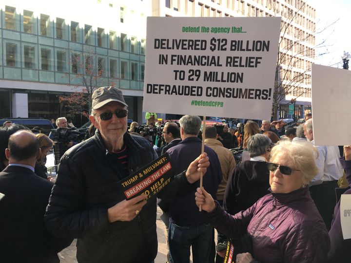 David and Allyne Pittle, retirees from Alexandria, Virginia, showed up to show their support for the Consumer Financial Protection Bureau's mission on Tuesday, Nov. 28, 2017.