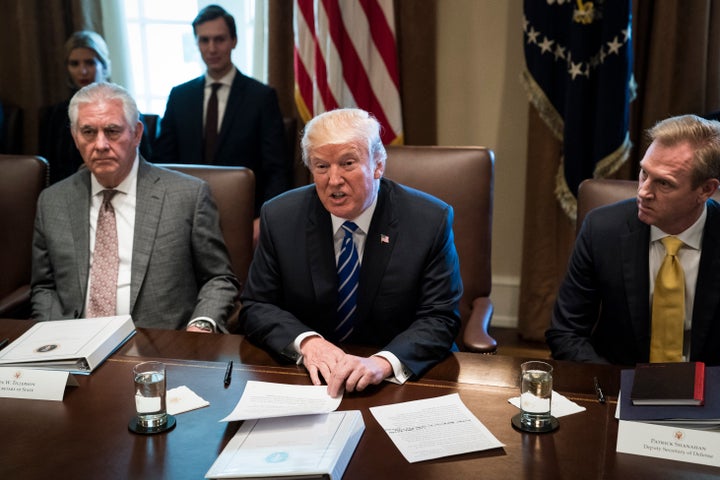 President Donald Trump, seen between Secretary of State Rex Tillerson and Deputy Secretary of Defense Patrick Shanahan, annou