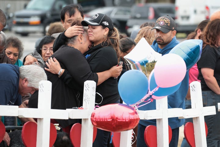 Visitors mourn the loss of family and friends at a memorial service for the 26 people killed at a church in Sutherland Spring