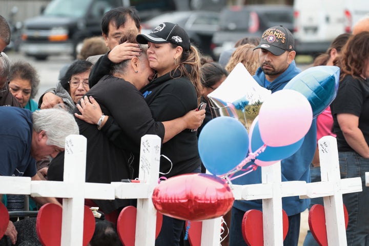 Visitors mourn the loss of family and friends at a memorial service for the 26 people killed at a church in Sutherland Springs, Texas, on Nov. 10, 2017.