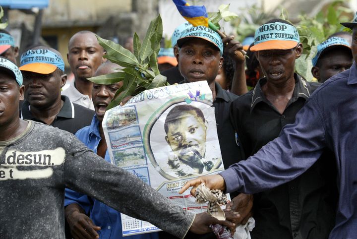 Ogoni activists carrying a poster of Ken Saro-Wiwa march on the Port Harcourt highway.