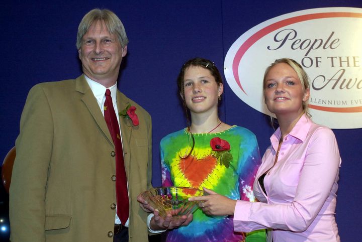 Josie Russell and her father, Dr Shaun, being presented with a People of the Year award in 2001