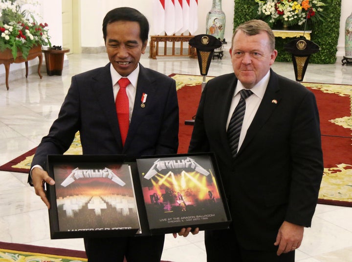 Indonesian President Joko Widodo, left, received a box set of Metallica's "Master of Puppets" from Danish Prime Minister Lars Lokke Rasmussen during a welcoming ceremony at the presidential palace in Bogor on Tuesday.