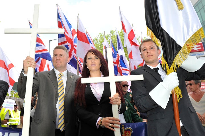 Golding, left, and Fransen, center, join a British First protest march at Bury Park on June 27, 2015, in Luton, England.