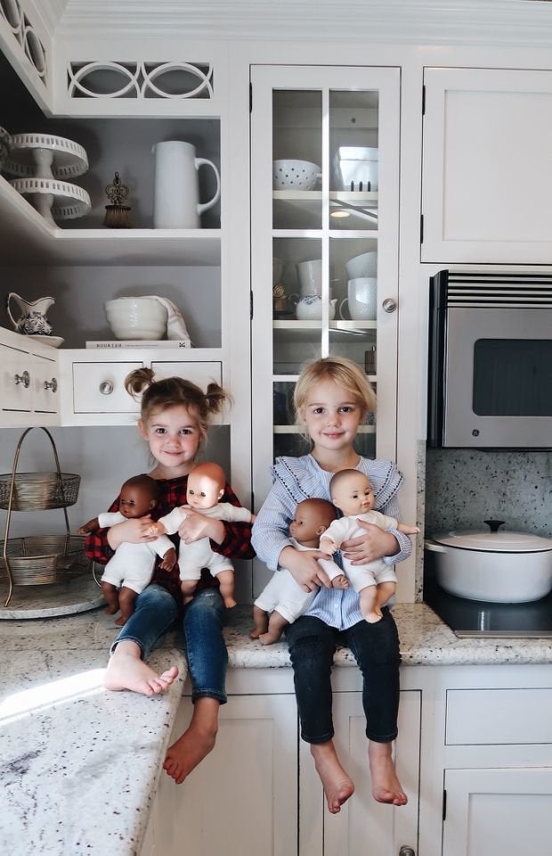 Mila and Emma holding their baby dolls. 