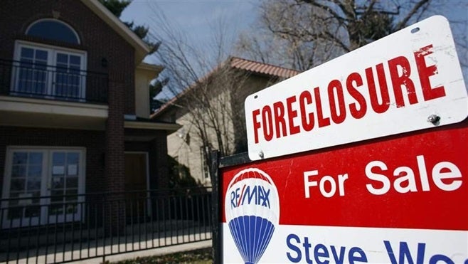 A foreclosure sign outside a Denver home. Some heartland markets have seen a bump in foreclosure starts despite 12-year lows nationwide.