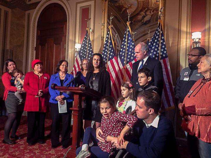 Senate Democrats Bob Casey and Mazie Hirono stand with families to oppose the GOP tax bill.