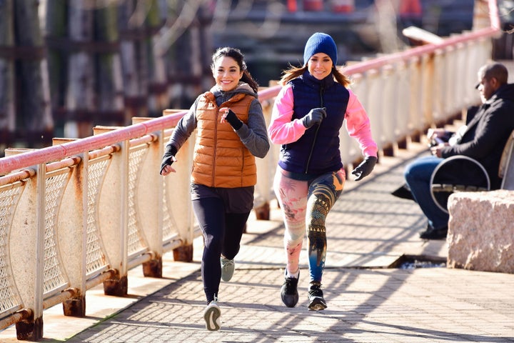 Vanessa Hudgens and Jennifer Lopez seen on location for 'Second Act' at South Street Seaport on November 27, 2017 in New York City.