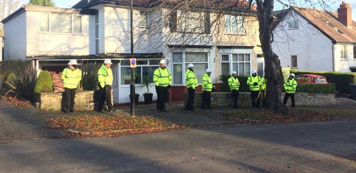 Private army blocking pavement access to allow felling of tree day before Christmas decoration display