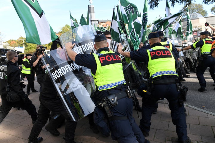 Police stop Nordic Resistance Movement members from walking along a forbidden street during their march in Gothenburg, Sweden, on Sept. 30.