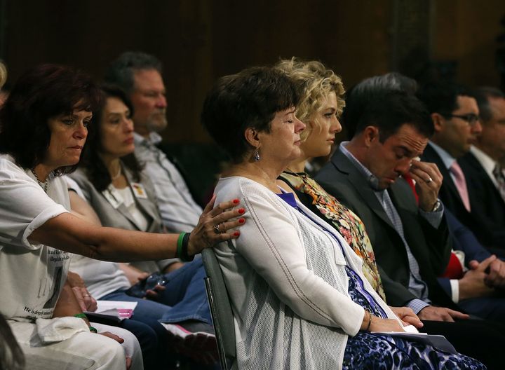 Liz Sullivan, center, the mother of Kate Steinle, is comforted during a Senate Judiciary Committee hearing July 21.