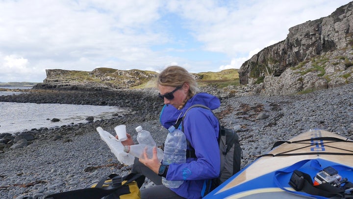 Cal Major holds some of the plastic trash she collected on the Isle of Skye.