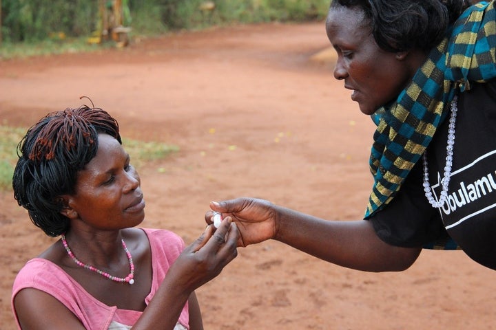 A community health worker in Uganda provides family planning services. Uganda will be severely impacted by the Global Gag Rule and has received HIV/AIDS relief funding under PEPFAR.