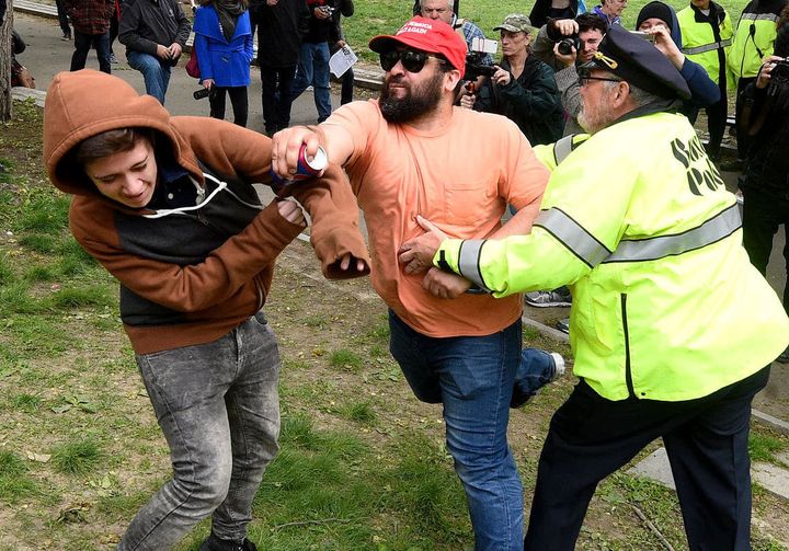 Sal Cipolla takes a swing at a counter-protester at a far-right rally in Boston on May 13.