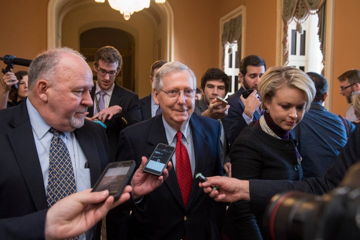 Senate Majority Leader Mitch McConnell (R-Ky.) talks to reporters Friday, several hours before the early Saturday vote.