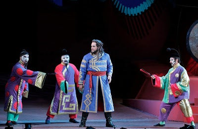 Ping, Pang, and Pong try to deter Prince Calaf (Brian Jagde) from pursuing PrincessTurandot in Puccini's opera