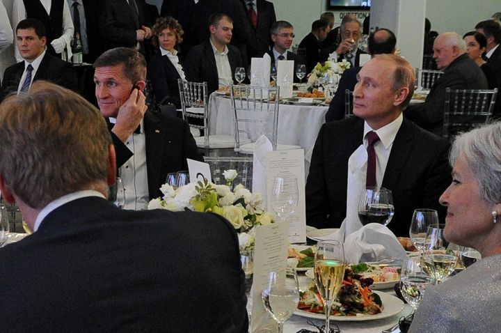 Former U.S. Defense Intelligence Agency Director and future Trump National Security Advisor Mike Flynn with Russian President Vladimir Putin in Moscow on December 10, 2015. Flynn was Putin’s special guest at the 10th anniversary dinner of the RT (Russia Today) channel. In the foreground are, with his back to camera, Putin spokesman Dmitry Peskov and Green Party presidential nominee Jill Stein.