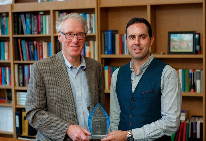Dr. Jon Wolpaw and research team member Dr. Amir Eftekhar with a recent award for "Most Innovative" at the 2017 ACRM Launchpad Competition.