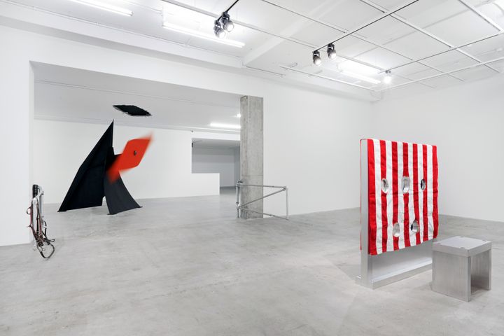 <p>Installation view of <em>Kinetics of Violence: Alexander Calder + Cady Noland</em>, curated by Sandra Antelo-Suarez, Venus Over Manhattan, 2017. Left and right center: Cady Nolan, open view of <em>Corral Gates</em>, 1989, pipes police straps, cattle straps. Collection Fondazione Sandretto Re Rebaudengo, Torino. Left center: Alexander Calder, <em>Rhombus,</em> metal, 1972. Moved by interaction with the blade. Collection of Calder Foundation. Far right: Cady Nolan, rear view of <em>Gibbet (in 2 parts</em>), aluminum, wood and fabric, 153 x 142.9 x 20.3 cm. (60.2 x 56.3 x 8 in.). Private Collection.</p>