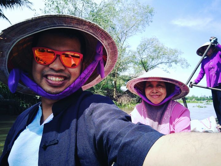Sampan ride along Mekong River Delta