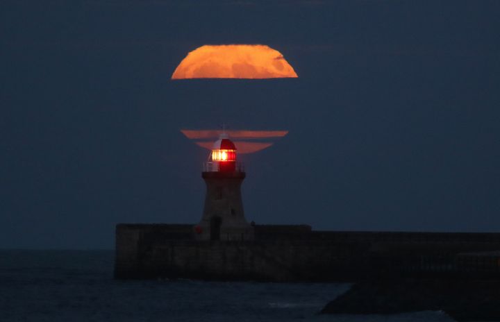 Supermoon above the lighthouse at South Shields, Tyne & Wear