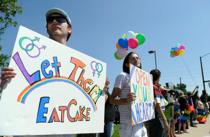 Charlie Craig (left) and David Mullins (second from left) and their supporters protest against Masterpiece Cakeshop in August 2012.