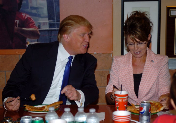 Sarah Palin and Donald Trump eating pizza at a Famiglia on Broadway. 