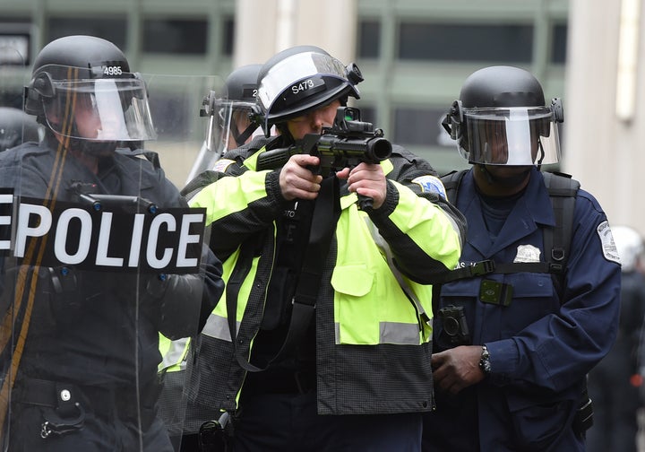 Police prepare to fire tear gas at protesters during the inauguration protests.