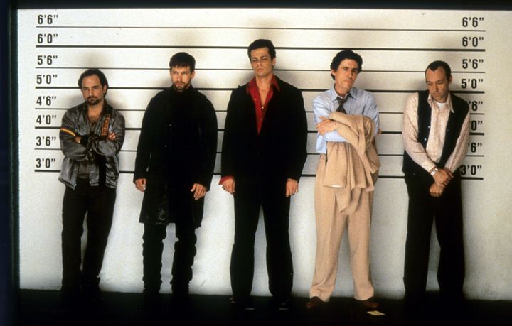 Kevin Pollak, Stephen Baldwin, Benicio del Toro, Gabriel Byrne and Kevin Spacey in a scene from the 1995 film “The Usual Suspects.”
