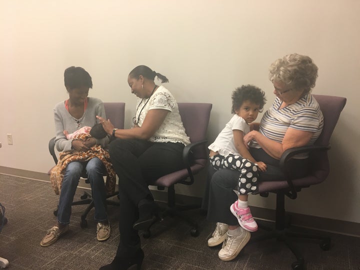 <p>From left to right, Hannah White with her newborn Maddilyn, Denise Duckett, her case manager, Nala, her 2-year-old daughter, and mother, Breta White, soon after her postpartum visit to the Mountain Area Education Health Center in Asheville, North Carolina.</p>