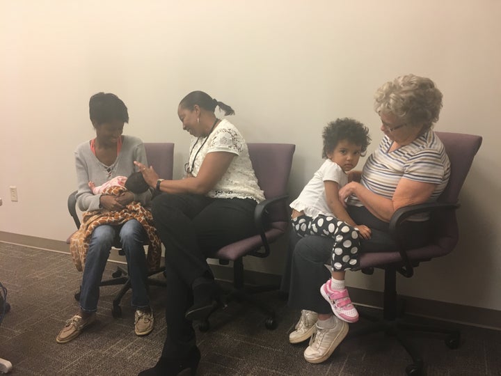 From left to right, Hannah White with her newborn Maddilyn, Denise Duckett, her case manager, Nala, her 2-year-old daughter, and mother, Breta White, soon after her postpartum visit to the Mountain Area Education Health Center in Asheville, North Carolina.