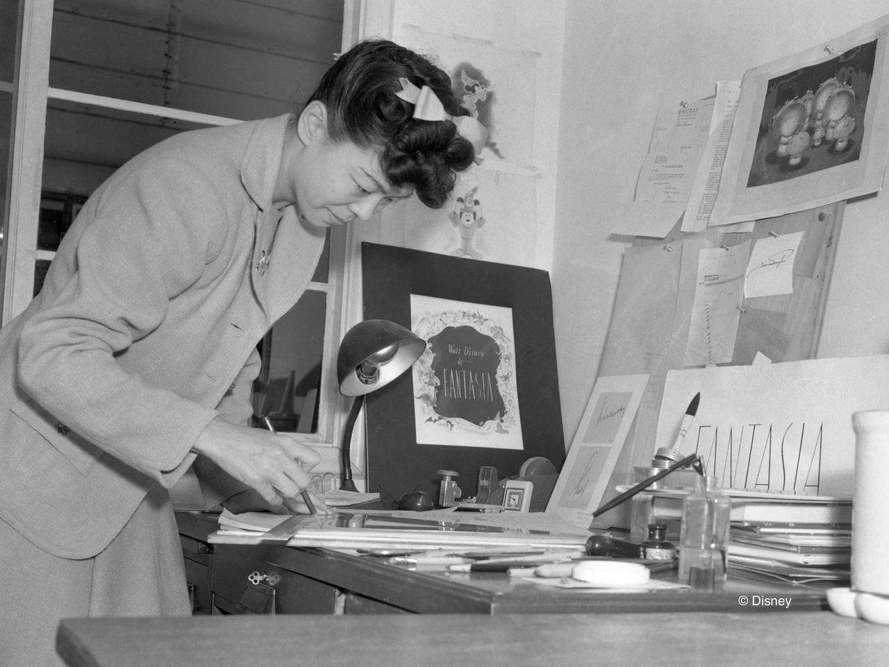 Artist Gyu Fujikawa works on a "Fantasia" product, circa 1939.