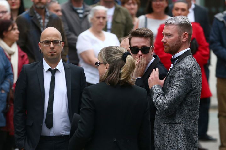 Martyn Hett's brother Dan Hett (L) and Martyn Hett's partner Russell Hayward (2nd R) arrive for the funeral of Martyn Hett at Stockport Town Hall.