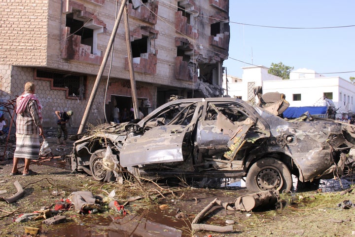 A damaged vehicle is seen at the site of a car bomb attack in the Yemeni city of Aden on Nov. 29.