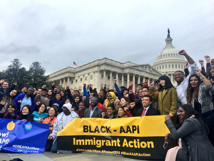 Asian-American and black activists rally to call for a clean Dream Act and a permanent solution for Temporary Protected Status holders.