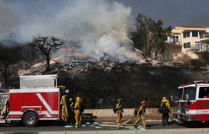 Firefighters were struggling to contain the blaze, which had burned more than 50,000 acres by Tuesday afternoon.