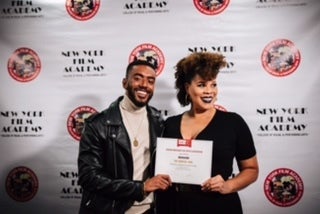 <p>From left to right cast member Etienne Maurice and Director Twinkie Bryd holding the award given by the African American Films Critic Association</p>