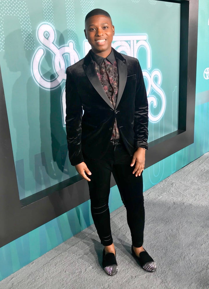 <p>Vaughn Alvarez takes a photo break on the red carpet at the Soul Train Music Awards</p>