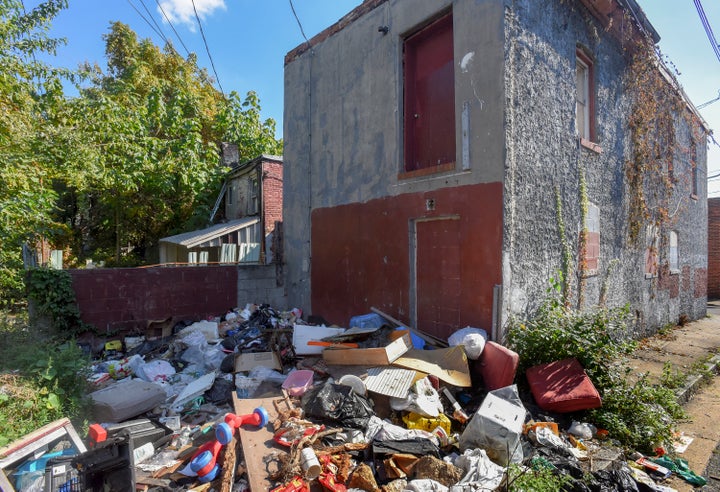 <p> Lemmon Street’s trash piles and vacant homes harbor rodents and insects that can set off asthma flare-ups.</p>