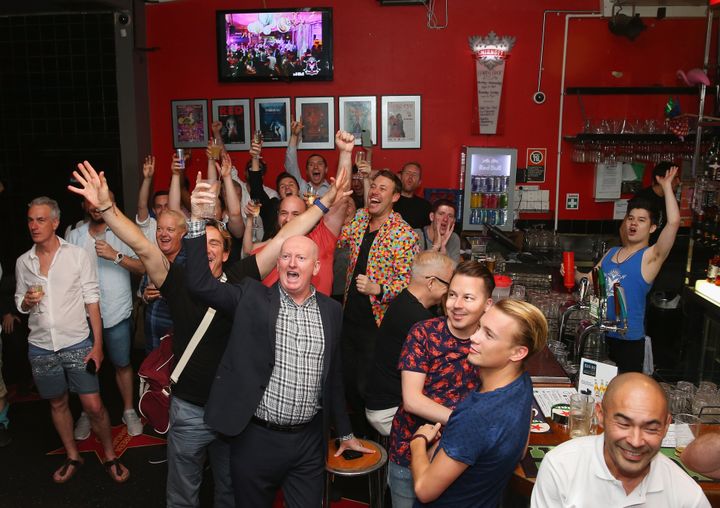 Patrons inside the Stonewall Hotel applaud the passing of the Gay Marriage Bill on December 7, 2017 in Sydney