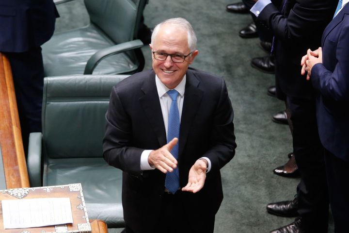 Australia's Prime Minister Malcolm Turnbull applauds after parliament passed the same-sex marriage bill in the Federal Parliament in Canberra on December 7, 2017