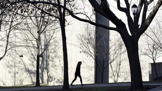 <p>A lone student walks on the campus of the Massachusetts College of Liberal Arts in North Adams. Some states are giving foster youth more guidance and financial support to help them obtain college degrees.</p>